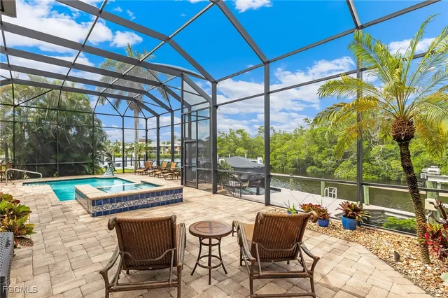 a view of swimming pool with a patio