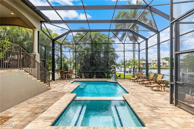 a view of a swimming pool with a patio