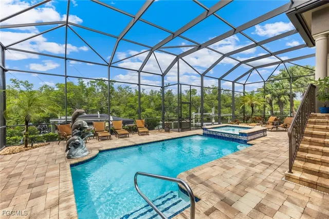 a view of swimming pool with outdoor seating
