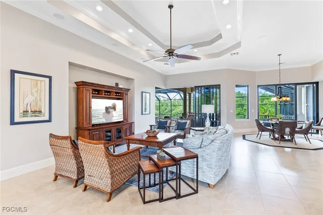 a dining room with furniture a chandelier and window