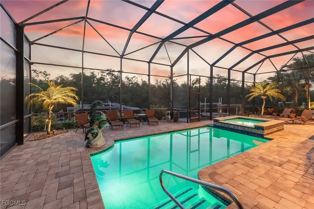 a swimming pool with patio outdoor seating and yard