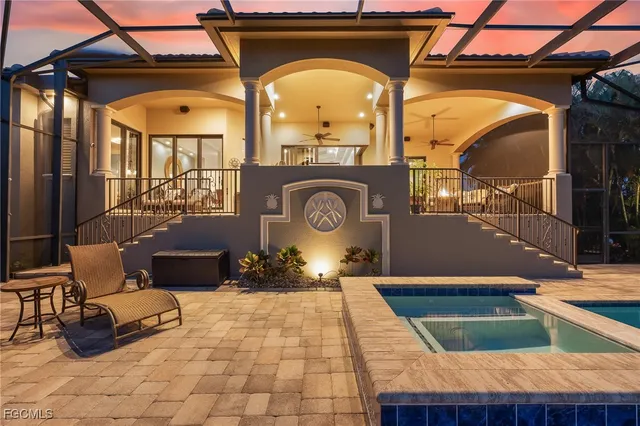 a view of house with outdoor space and lake view