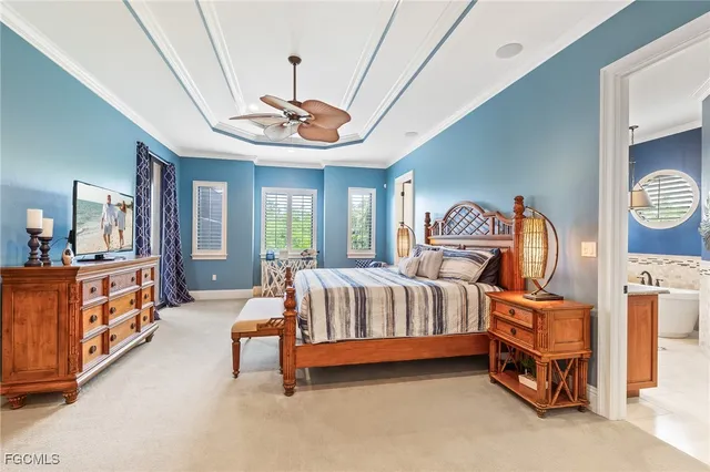 a bedroom with furniture and a chandelier