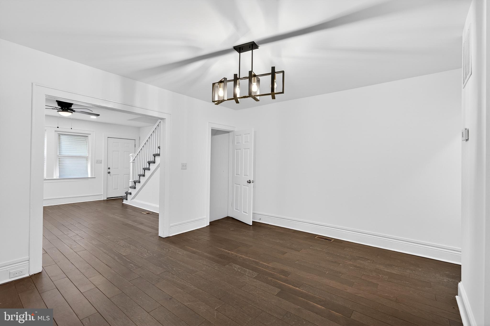 7014 Belclare Road Baltimore, MD 21222 - Photo 12 of 36 a view of empty room with wooden floor
