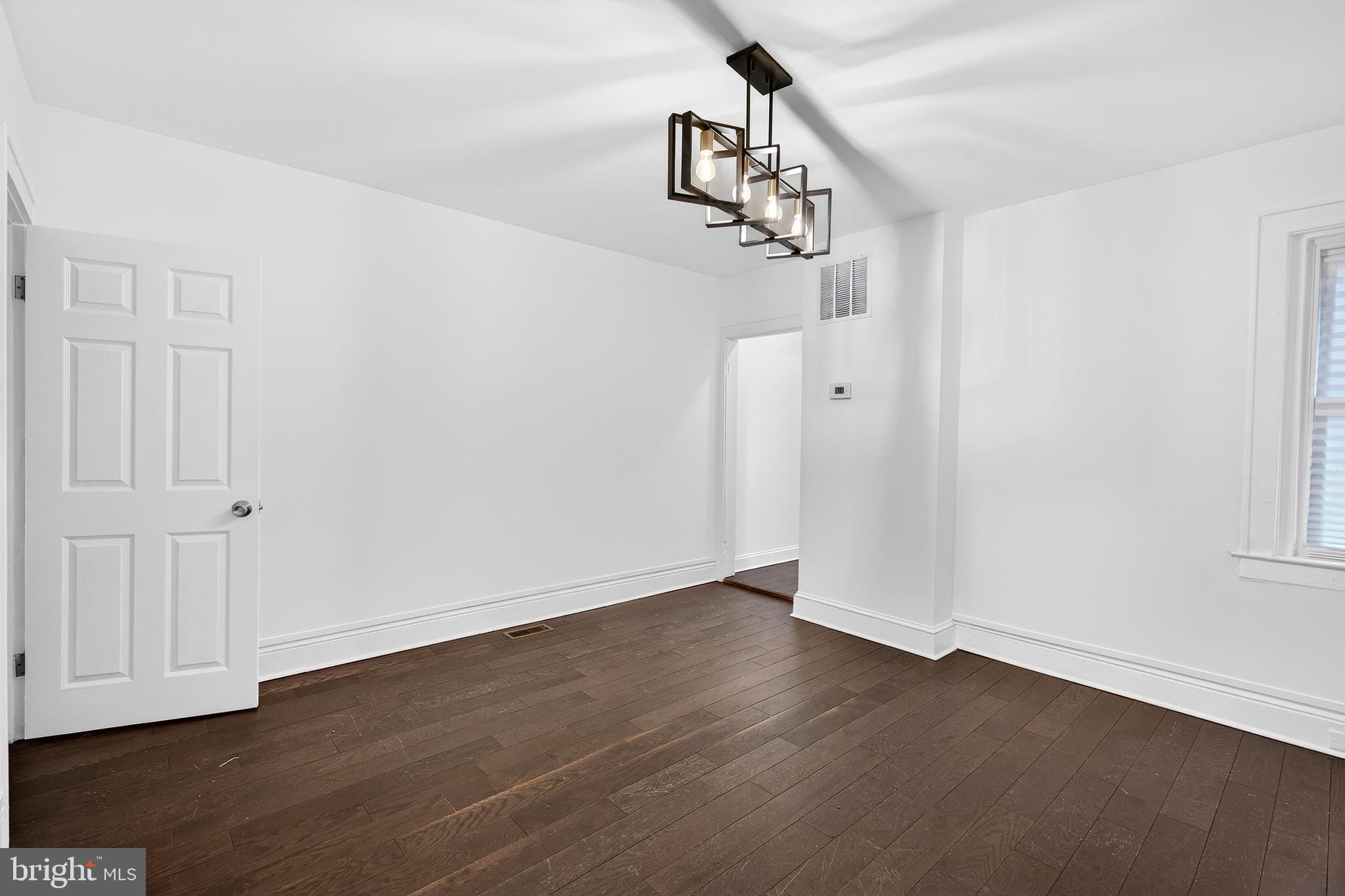 7014 Belclare Road Baltimore, MD 21222 - Photo 13 of 36 wooden floor in an empty room
