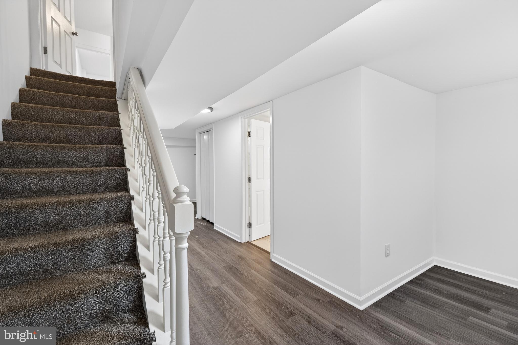 7014 Belclare Road Baltimore, MD 21222 - Photo 17 of 36 a view of entryway with wooden floor