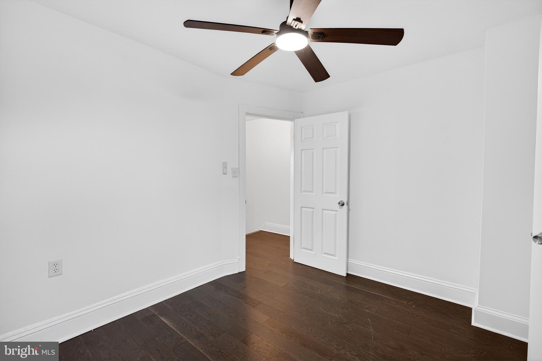7014 Belclare Road Baltimore, MD 21222 - Photo 25 of 36 an empty room with closet and windows