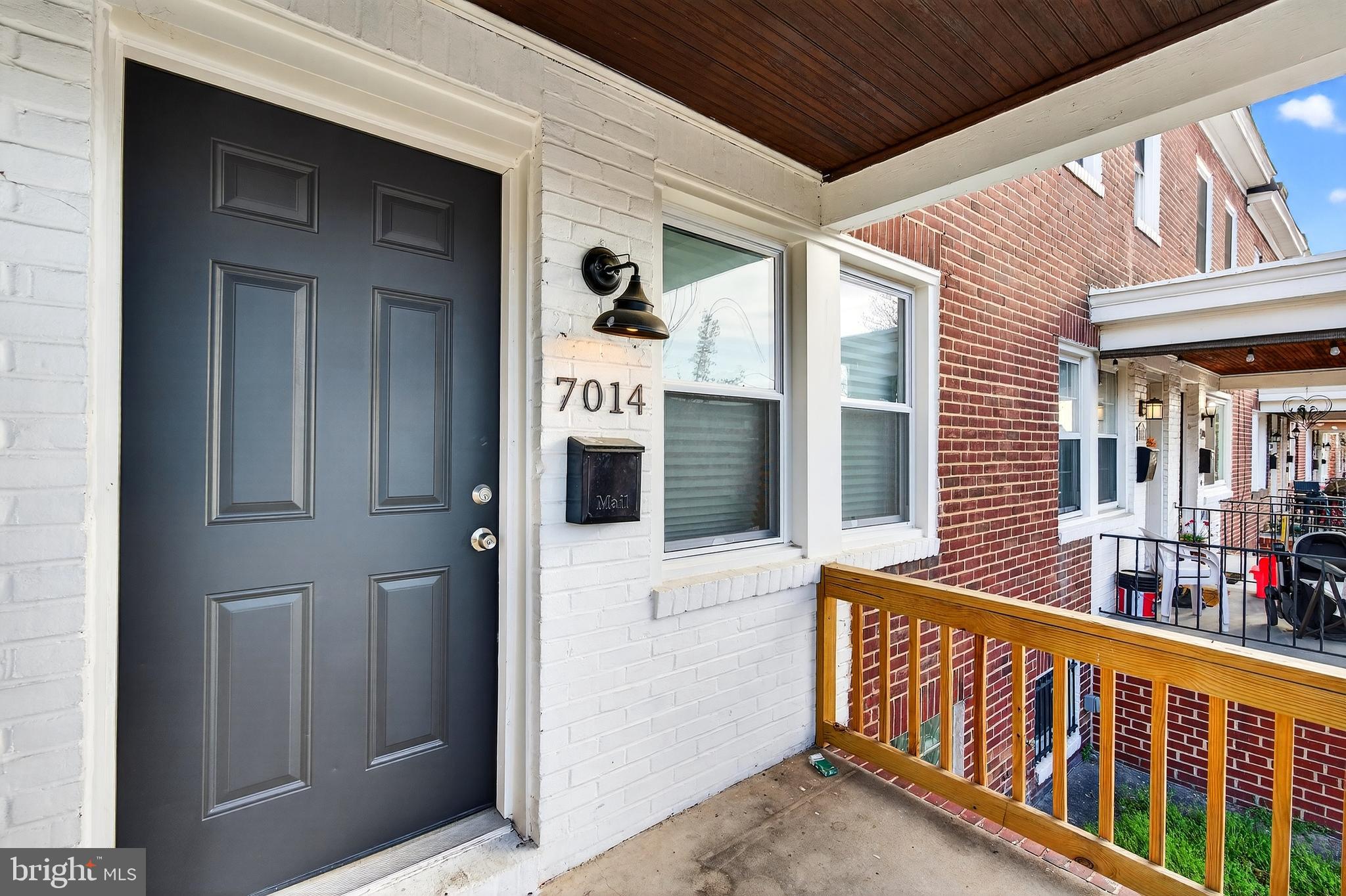 7014 Belclare Road Baltimore, MD 21222 - Photo 31 of 36 a view of a house with large window and wooden fence