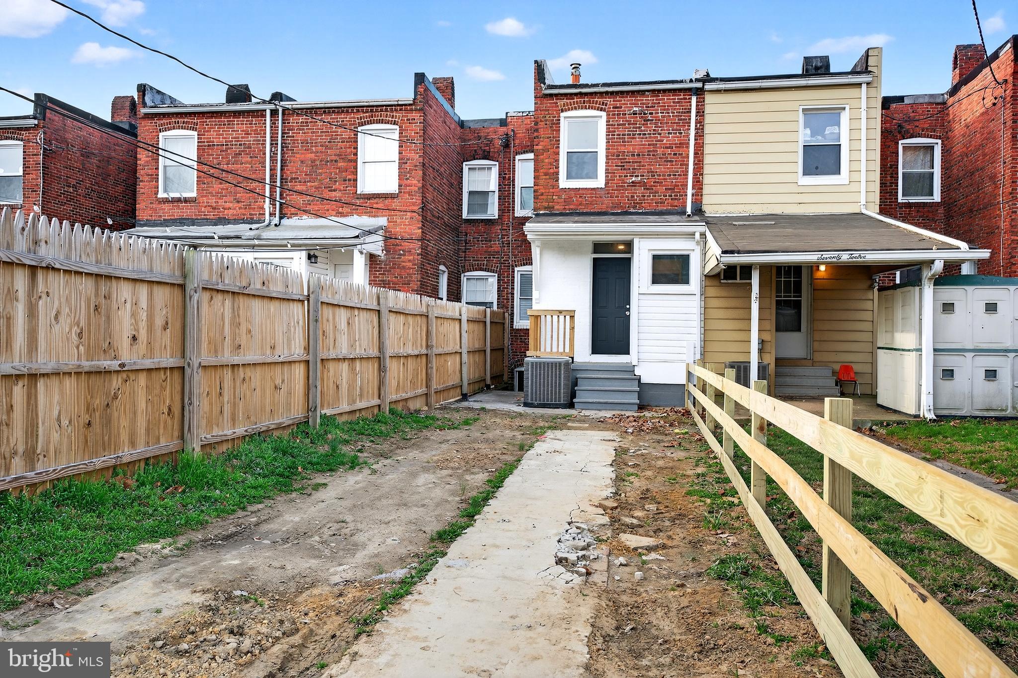 7014 Belclare Road Baltimore, MD 21222 - Photo 33 of 36 a front view of a house with a yard