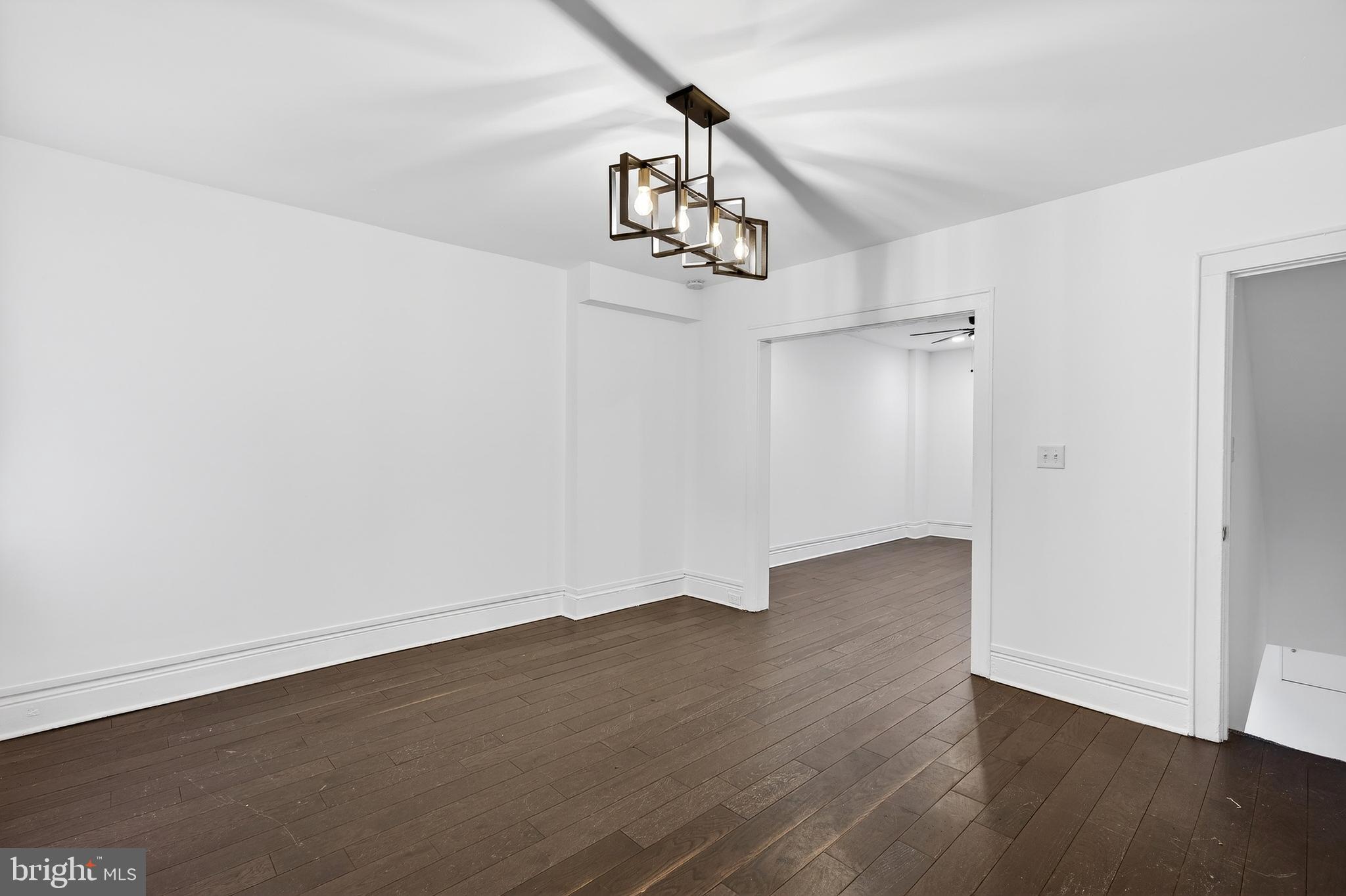 7014 Belclare Road Baltimore, MD 21222 - Photo 7 of 36 wooden floor in an empty room