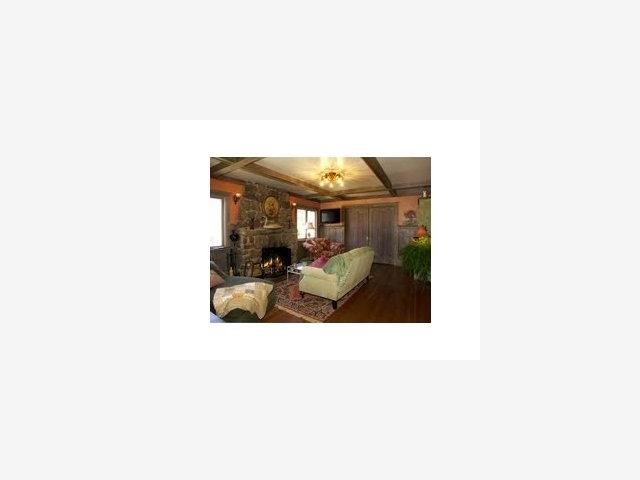 201 Central Avenue Pacific Grove, CA 93950 - Photo 2 of 6 a living room with furniture and a car window