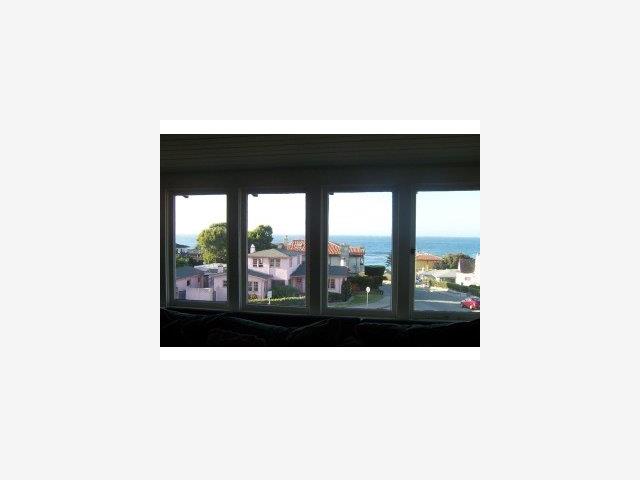 201 Central Avenue Pacific Grove, CA 93950 - Photo 3 of 6 a living room with a large window