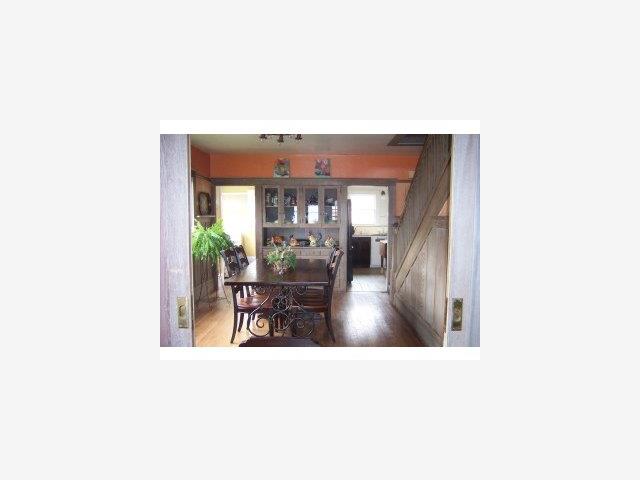 201 Central Avenue Pacific Grove, CA 93950 - Photo 5 of 6 a picture of a living room with a table and chairs