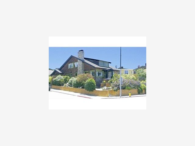 201 Central Avenue Pacific Grove, CA 93950 - Photo 6 of 6 a view of a house with a small yard and potted plants