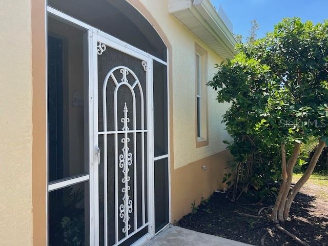 3181 Matecumbe Key Road, Unit 10 Punta Gorda, FL 33955 - Photo 11 of 52 a view of a entryway door of the house