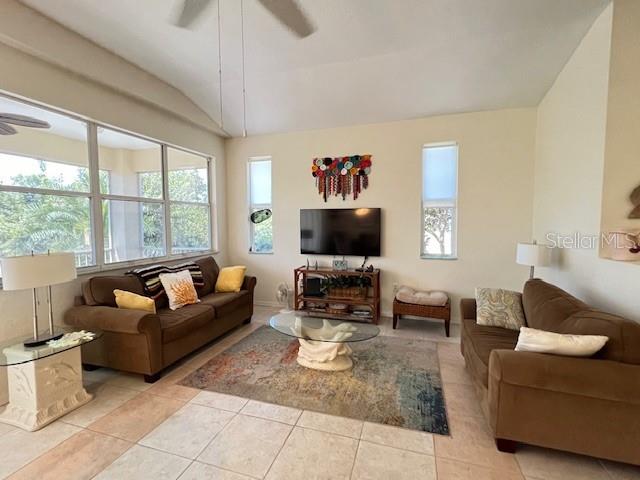 3181 Matecumbe Key Road, Unit 10 Punta Gorda, FL 33955 - Photo 12 of 52 a living room with furniture and a flat screen tv