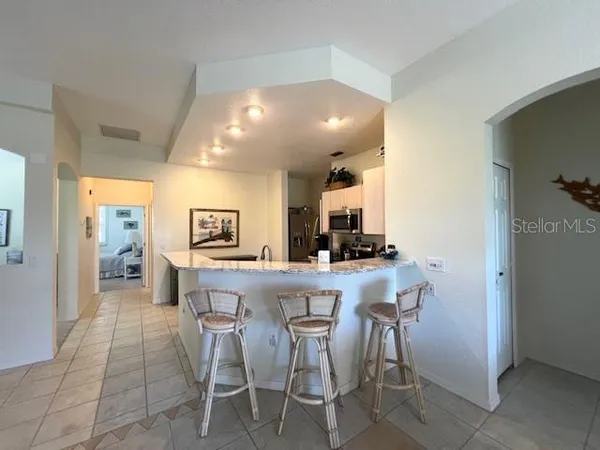 a kitchen with a table and chairs in it