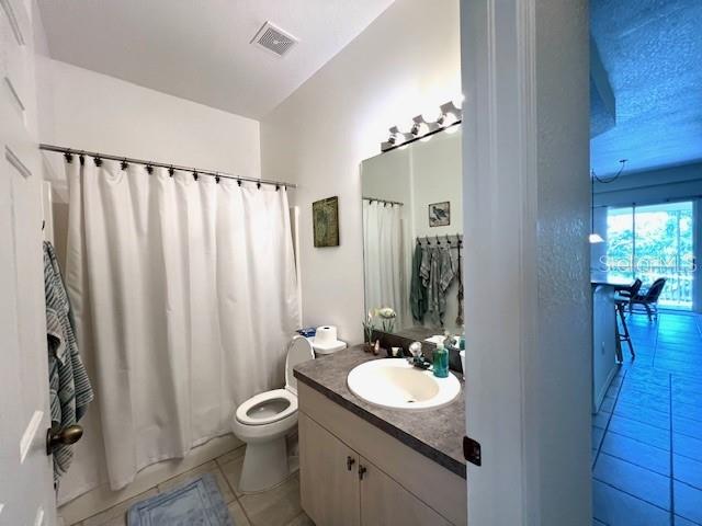3181 Matecumbe Key Road, Unit 10 Punta Gorda, FL 33955 - Photo 23 of 52 a bathroom with a granite countertop sink toilet and shower