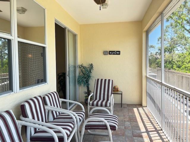 3181 Matecumbe Key Road, Unit 10 Punta Gorda, FL 33955 - Photo 25 of 52 a balcony view with two chairs and a table