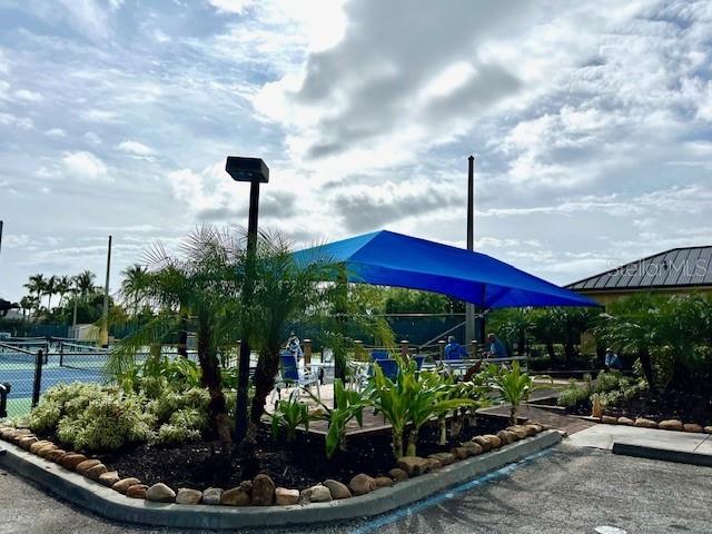 3181 Matecumbe Key Road, Unit 10 Punta Gorda, FL 33955 - Photo 46 of 52 a view of a garden with a patio