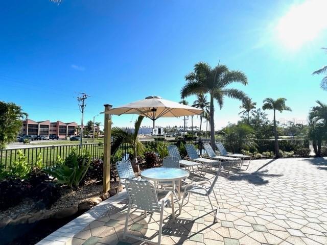 3181 Matecumbe Key Road, Unit 10 Punta Gorda, FL 33955 - Photo 5 of 52 a view of a swimming pool with a patio