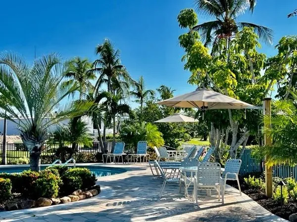 a view of a backyard with sitting area