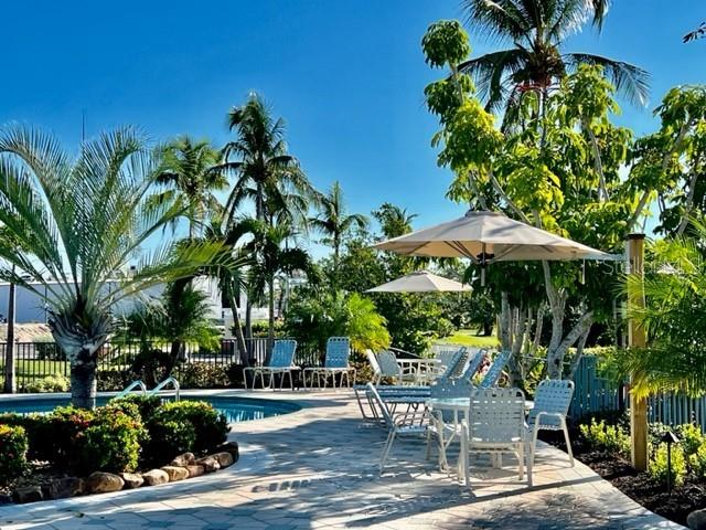 3181 Matecumbe Key Road, Unit 10 Punta Gorda, FL 33955 - Photo 6 of 52 a view of a backyard with sitting area