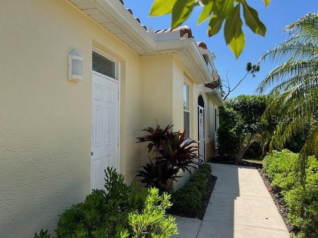 3181 Matecumbe Key Road, Unit 10 Punta Gorda, FL 33955 - Photo 10 of 52 a view of a house with potted plants