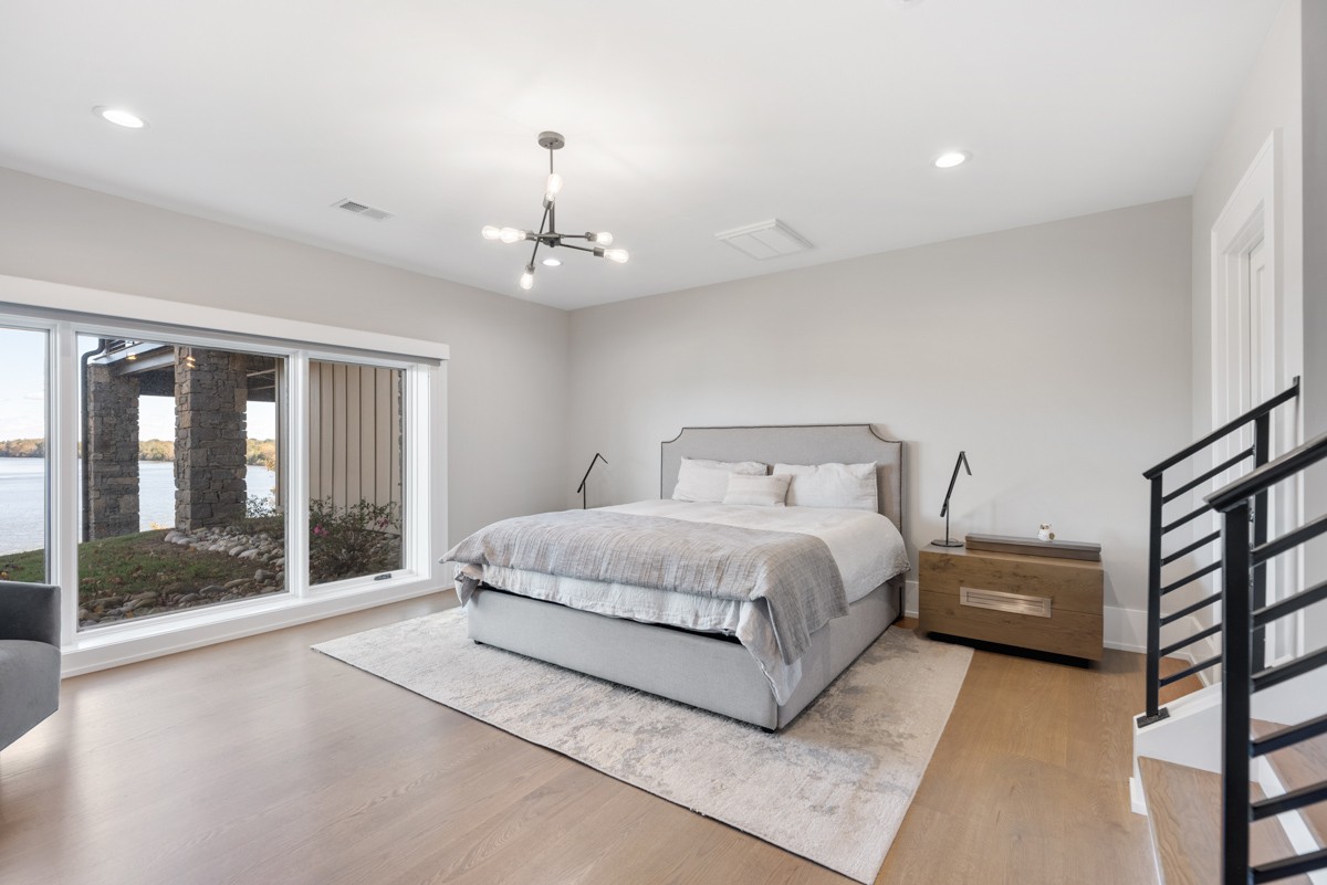 5893 Cairo Bend Road Lebanon, TN 37087 - Photo 21 of 47 a spacious bedroom with a bed and a large window