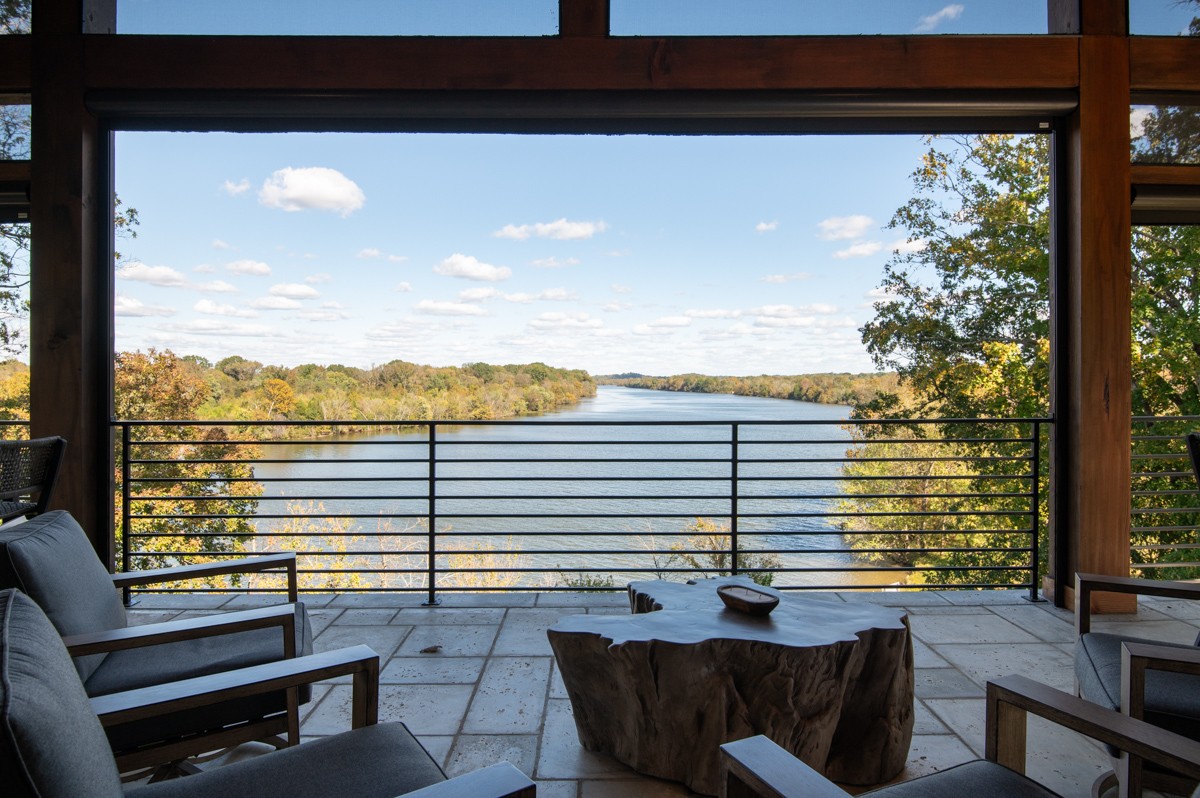 5893 Cairo Bend Road Lebanon, TN 37087 - Photo 40 of 47 a view of a balcony with floor to ceiling windows and wooden floor