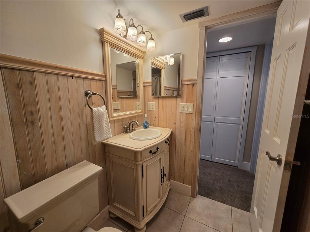 1640 Juno Trail, Unit 103C Astor, FL 32102 - Photo 15 of 20 a bathroom with a sink a toilet and shower