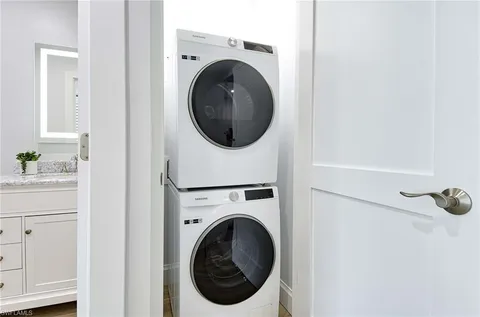 a view of a hallway with washer and dryer