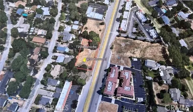 an aerial view of a residential apartment building with parking space