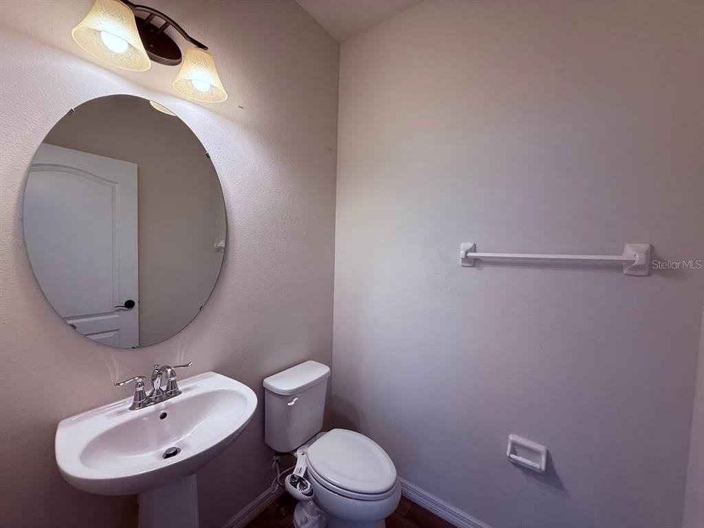 14112 Poke Ridge Drive Riverview, FL 33579 - Photo 10 of 32 a bathroom with a sink and a mirror
