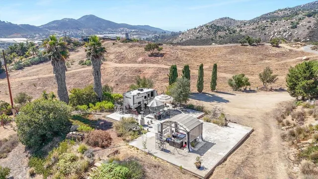 a view of a chairs and table in the patio