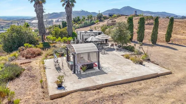 a view of a chairs and table in the patio