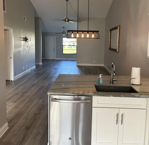 a view of a bathroom with a toilet and a shower