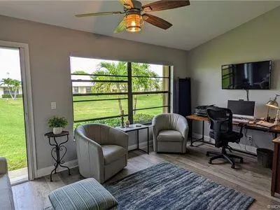 a living room with furniture and a window
