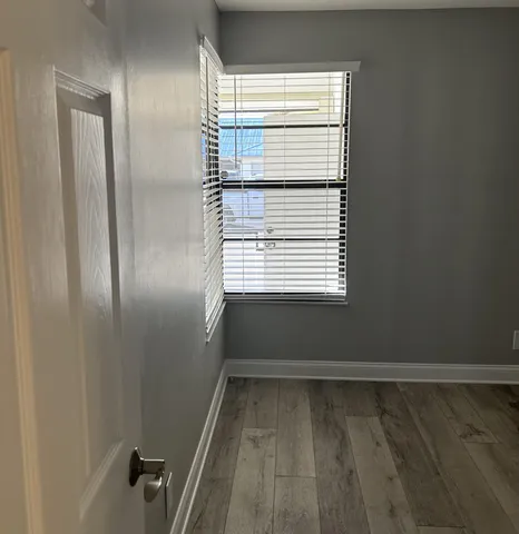 a white toilet sitting next to a bath tub