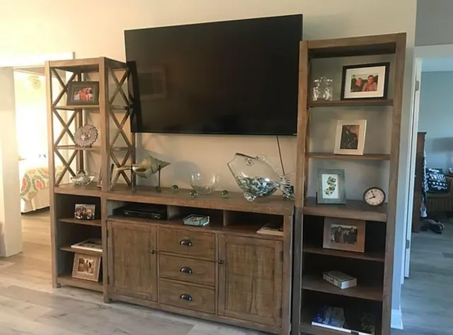 a kitchen with a sink a counter and a window