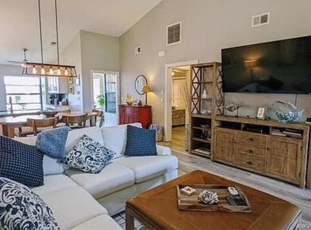 a kitchen with a sink appliances and cabinets