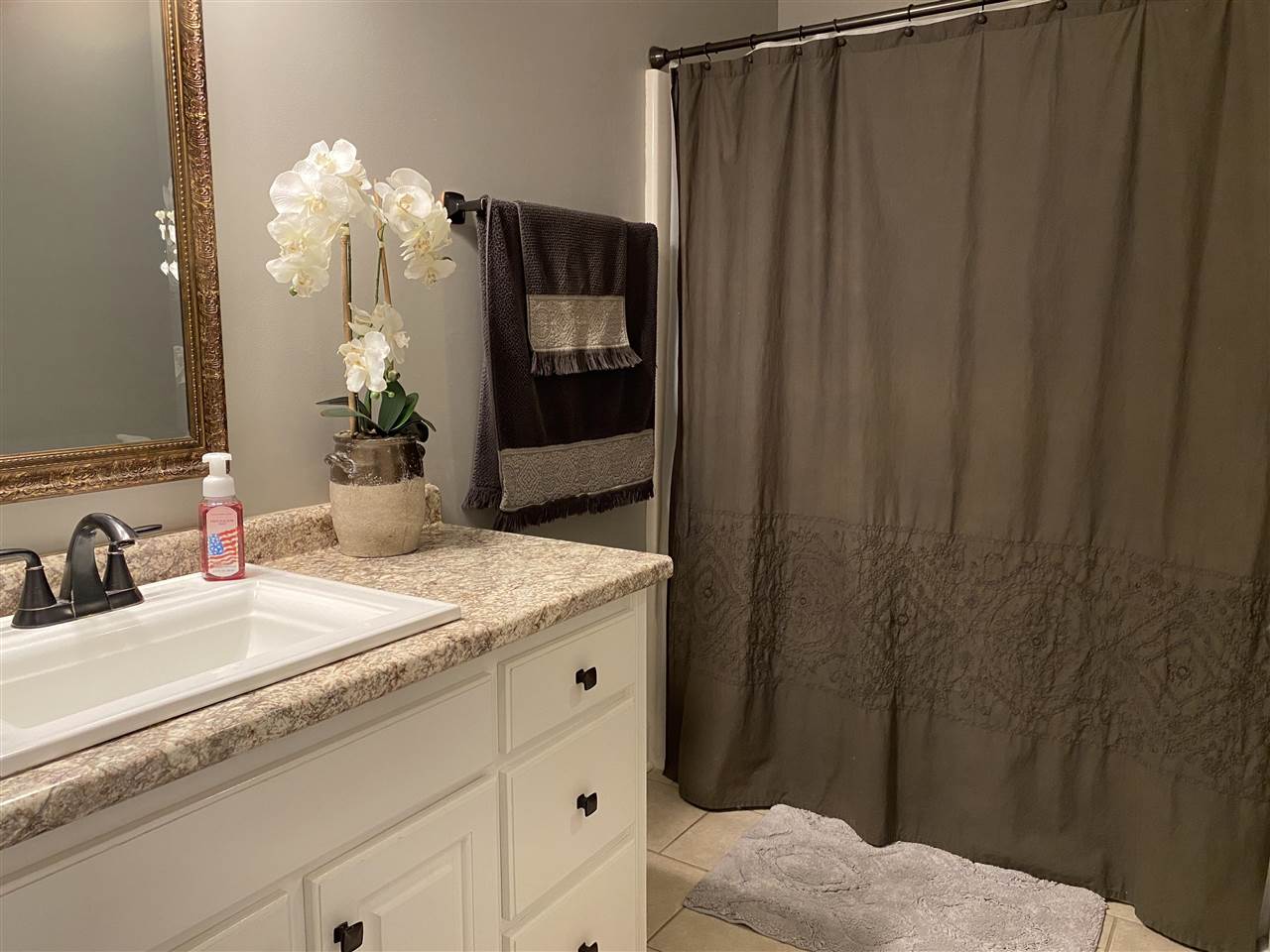 147 Racetrack Drive Cochran, GA 31014 - Photo 19 of 23 a bathroom with a sink and a mirror