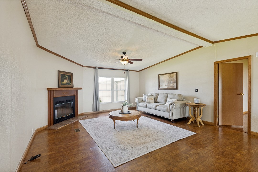 207 Vivian Road Onalaska, TX 77360 - Photo 9 of 34 a living room with furniture and a fireplace