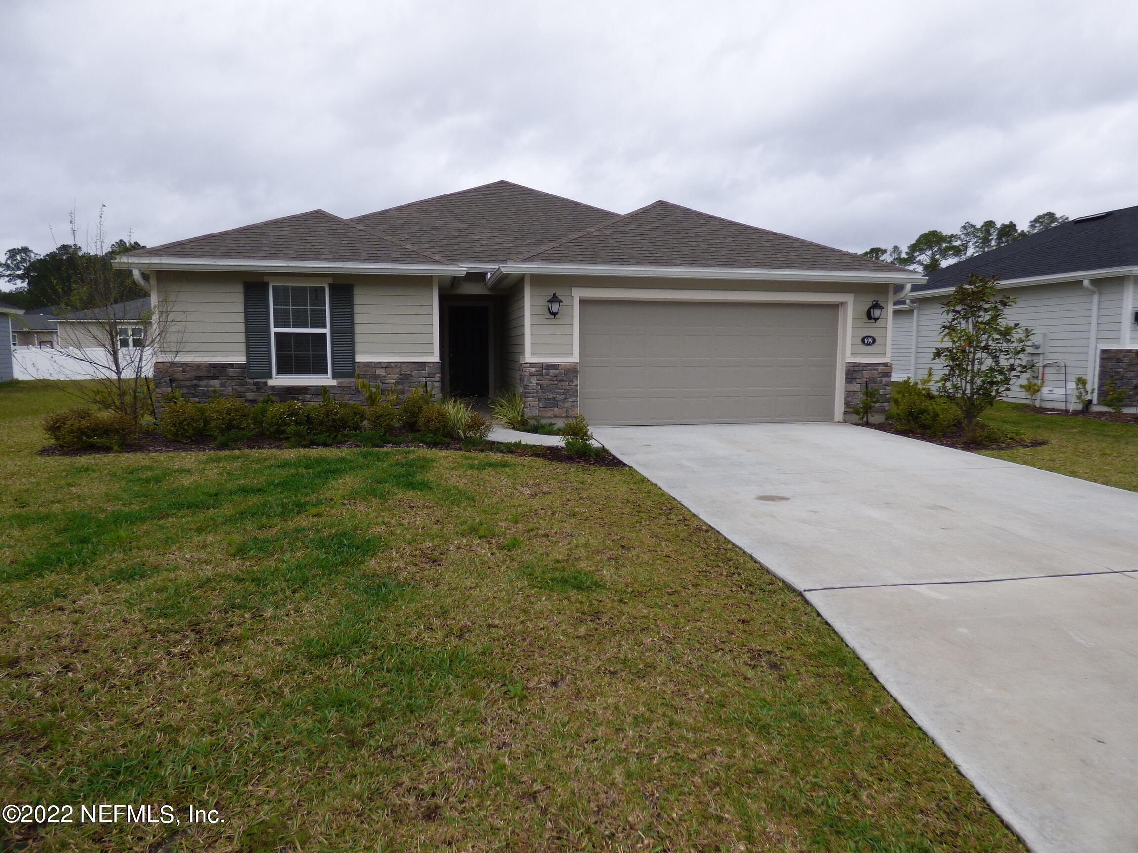 699 Flach Drive St. Johns, FL 32259 - Photo 1 of 25 Front of Home