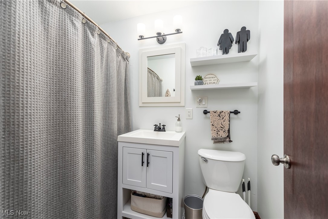 1605 Lander Road Cleveland, OH 44124 - Photo 20 of 38 Full bath featuring vanity and a shower with curtain