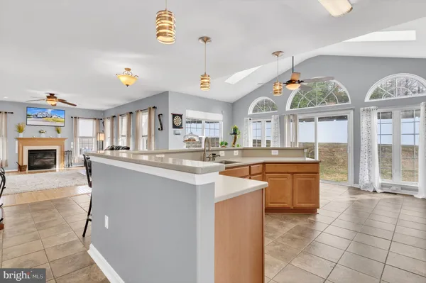 a living room with furniture a window and a fireplace
