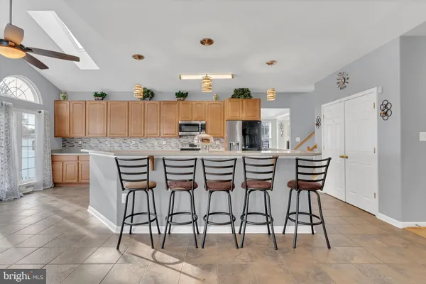 a living room with furniture a window and a fireplace