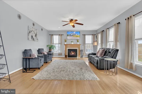 a bedroom with furniture and a book shelf