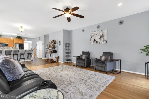 a view of a livingroom with furniture and a window