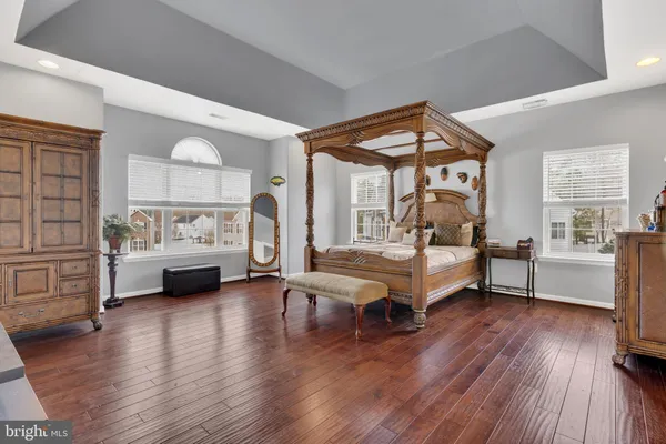 a view of a lake with a house in the background